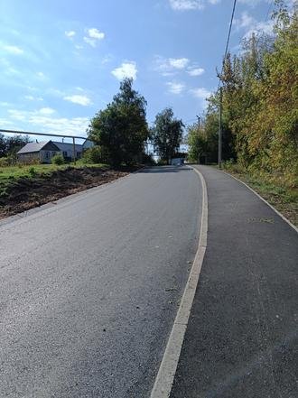 Белгородская область, поселок Ракитное, улица Колхозная. Дорога после ремонта (к информации о выполнении поручения по итогам личного приема граждан, проведенного А.К.Ниязметовым 4.08.2022)