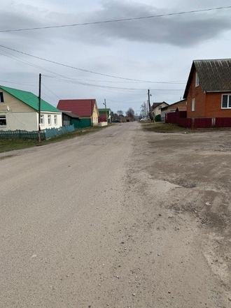 Калужская область, Сухиничи, улица Чернышевского. Дорога в состоянии на дату личного приема граждан, проведенного И.П.Горячевой 26 мая 2022 года