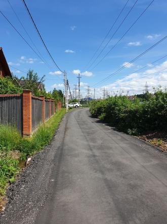 Московская область, Наро-Фоминский городской округ, Апрелевка, 2-я Майская улица. Дорога после ремонта (к информации о выполнении поручения по итогам приема граждан, проведенного А.А.Шаклуновым 25 мая 2021 года)