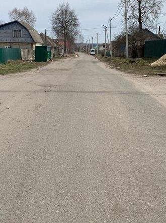 Калужская область, Сухиничи, улица Чернышевского. Дорога в состоянии на дату личного приема граждан, проведенного И.П.Горячевой 26 мая 2022 года
