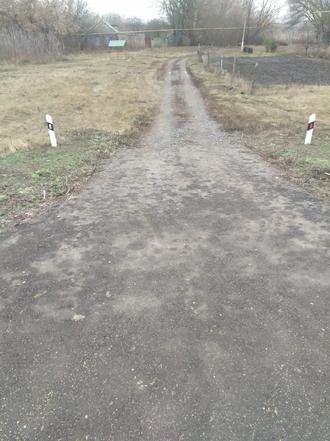 Белгородская область, Прохоровский район, село Раисовка, улица Раевского. Дорога в состоянии на дату личного приема граждан, проведенного А.Ю.Петуховым 16 декабря 2021 года